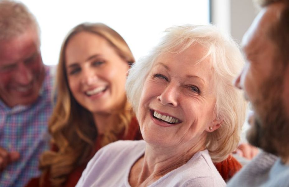 a group of people smiling and chatting together